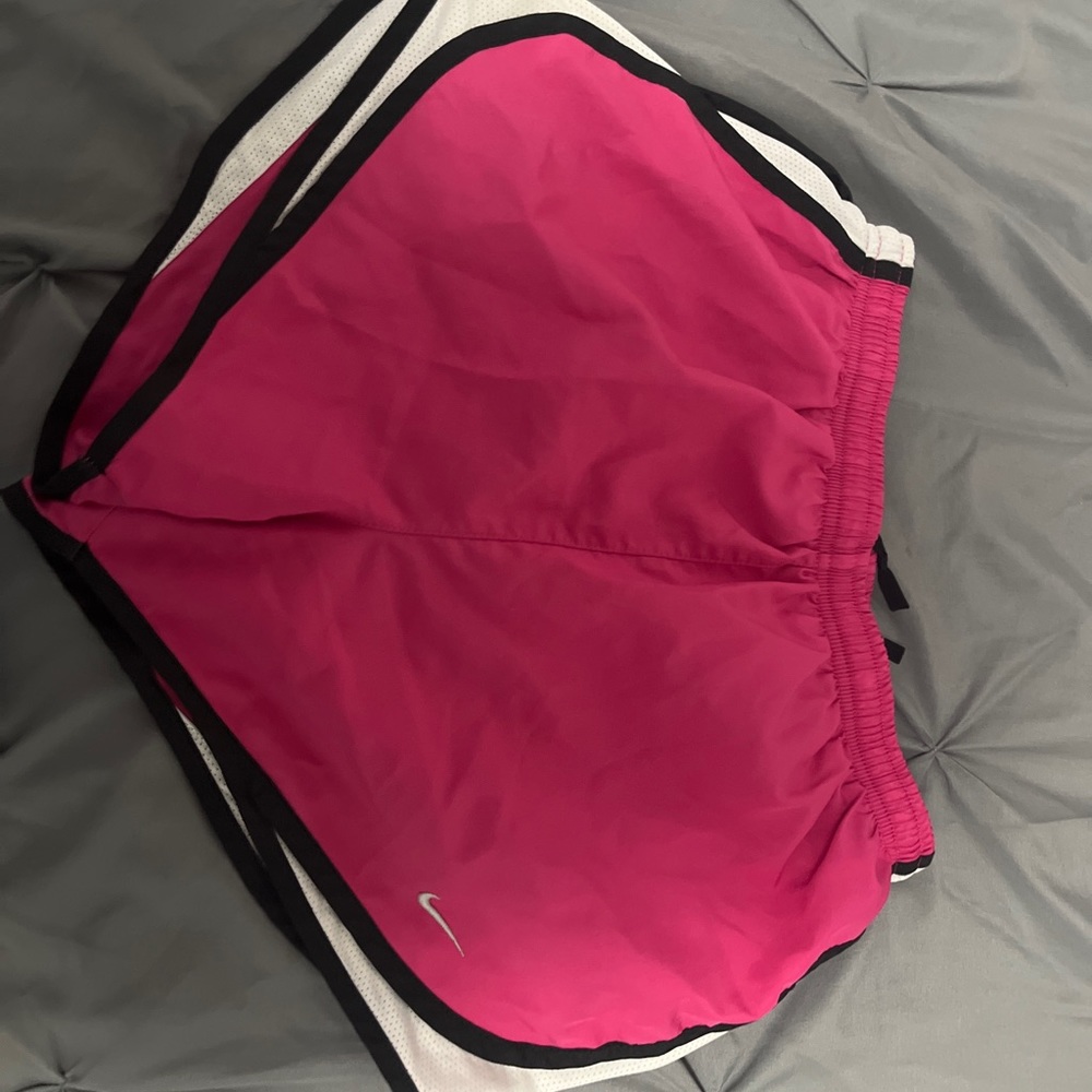 Pink and black embroidered Nike running shorts. Size small, and no flaws.